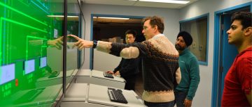 Dr. Fredrik Ahlgren demonstrates engine room simulator to Naval Architecture and Marine Engineering students