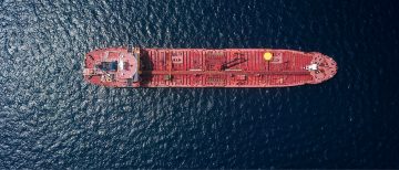 Aerial view of a ship surrounded by water. Photocredit: Shaah Shahidh, Unsplash